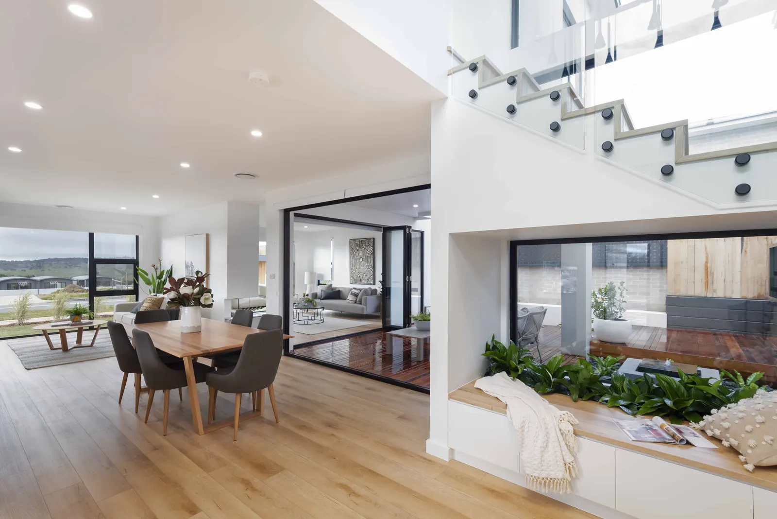 Open plan living and dining with window seat overlooking the internal courtyard