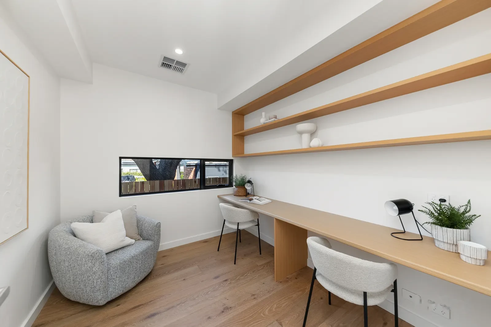 Fitted study with full width timber desk and shelf for two